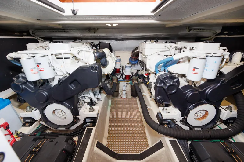 Slide: The Image of Engine room of 2016 Sabre 42 Fly Bridge Sedan with dual engines and mechanical components. - 34