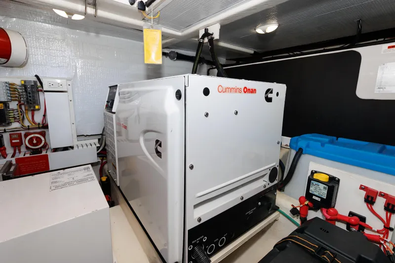 Slide: The Image of Engine room of 2016 Sabre 42 Fly Bridge Sedan with Cummins Onan generator. - 35