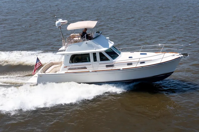 Slide: The Image of 2016 Sabre 42 Fly Bridge Sedan cruising on open water. - 44