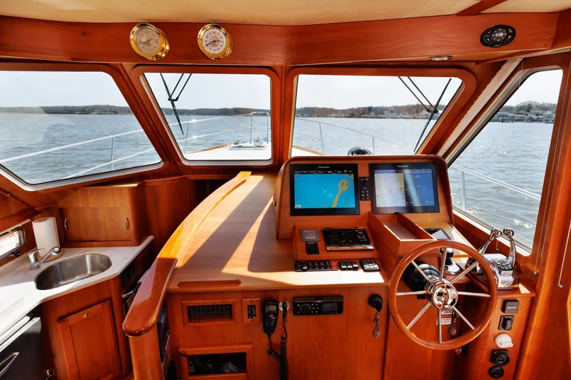 Slide: The Image of Interior view of 2016 Sabre 42 Fly Bridge Sedan yacht helm with navigation screens. - 9
