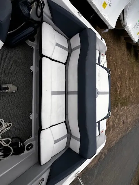 Slide: The Image of Interior of a 2015 Four Winns Horizon 180 boat, white and gray upholstery. - 3