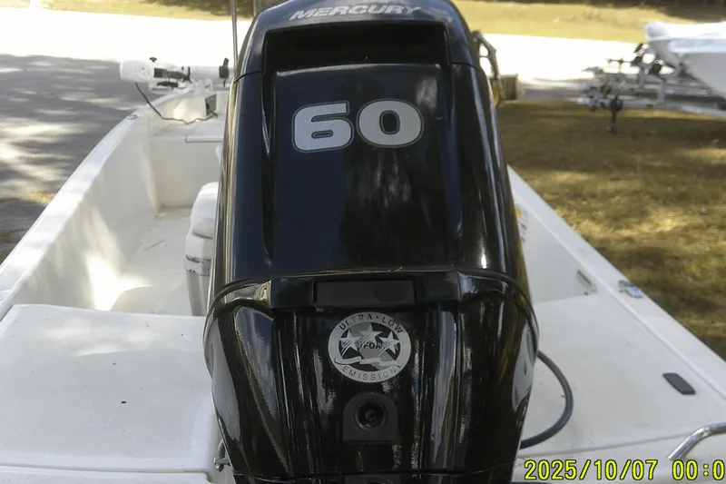 Slide: The Image of 2024 Mako Pro Skiff 15 CC with Mercury 60 outboard engine. - 14
