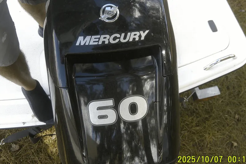 Slide: The Image of Mercury 60 horsepower engine on 2024 Mako Pro Skiff 15 CC boat. - 32