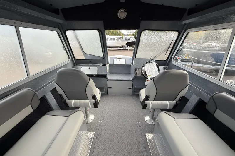 Slide: The Image of Interior of 2026 KingFisher 2025 Escape HTT boat with seating and helm. - 10