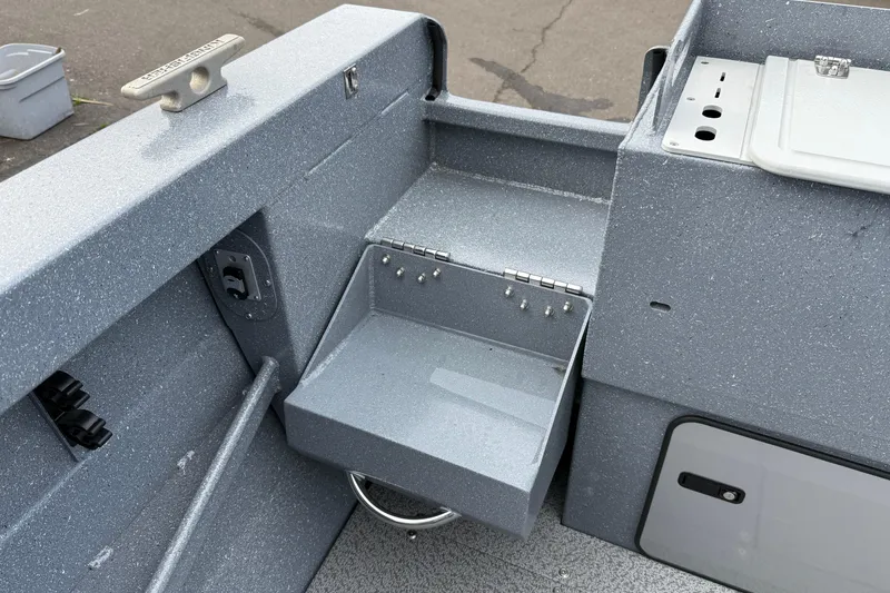 Slide: The Image of Interior view of a 2026 KingFisher 2025 Escape HTT boat, showcasing storage compartments. - 12