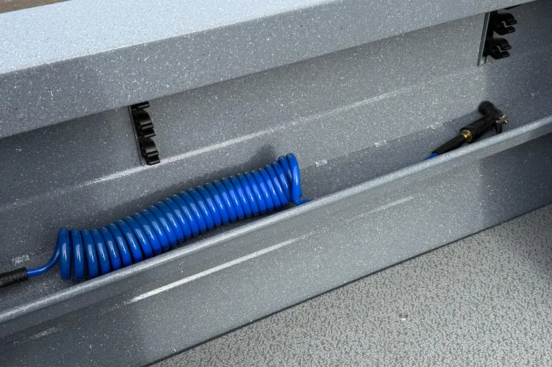 Slide: The Image of Blue coiled hose in KingFisher 2025 Escape HTT boat storage compartment, 2026 model. - 14