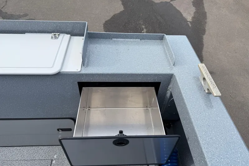 Slide: The Image of Open storage compartment on KingFisher 2025 Escape HTT boat, showcasing sleek design. - 15