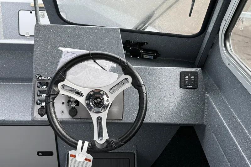 Slide: The Image of Steering console of 2026 KingFisher 2025 Escape HTT boat with modern controls. - 17