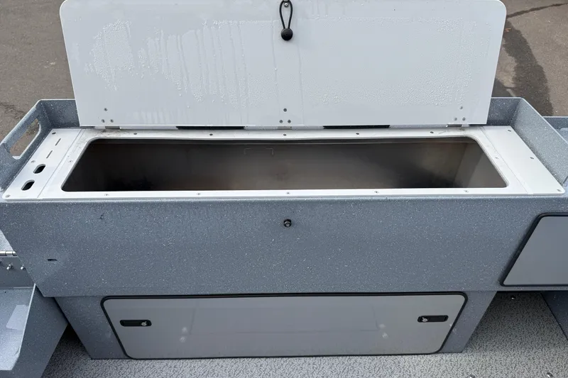 Slide: The Image of Open storage compartment on a 2026 KingFisher 2025 Escape HTT boat. - 19