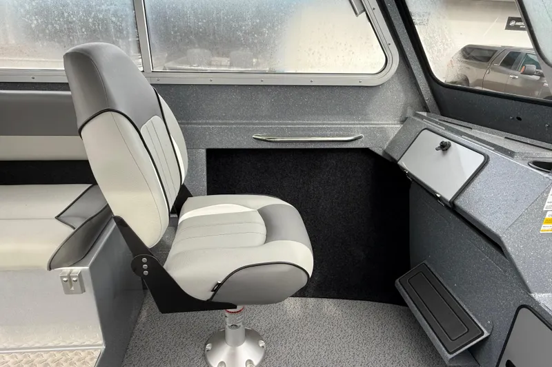 Slide: The Image of Interior of 2026 KingFisher 2025 Escape HTT boat, featuring a modern captain's chair. - 20