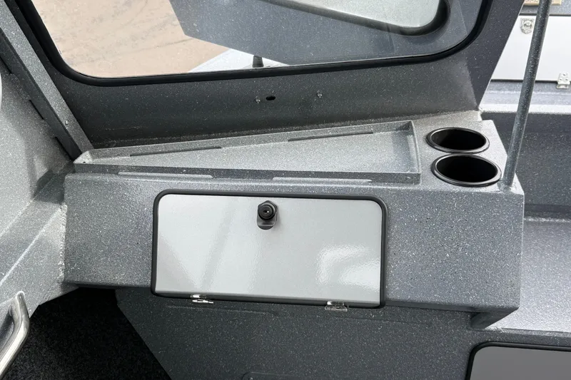 Slide: The Image of Interior of 2026 KingFisher 2025 Escape HTT boat with storage compartment and cup holders. - 21