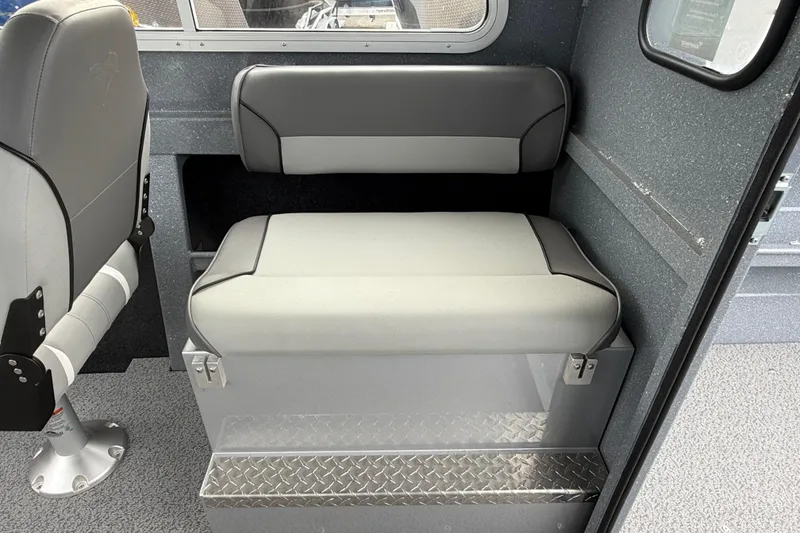 Slide: The Image of Interior seating of 2026 KingFisher 2025 Escape HTT boat, featuring gray cushioned seats. - 28