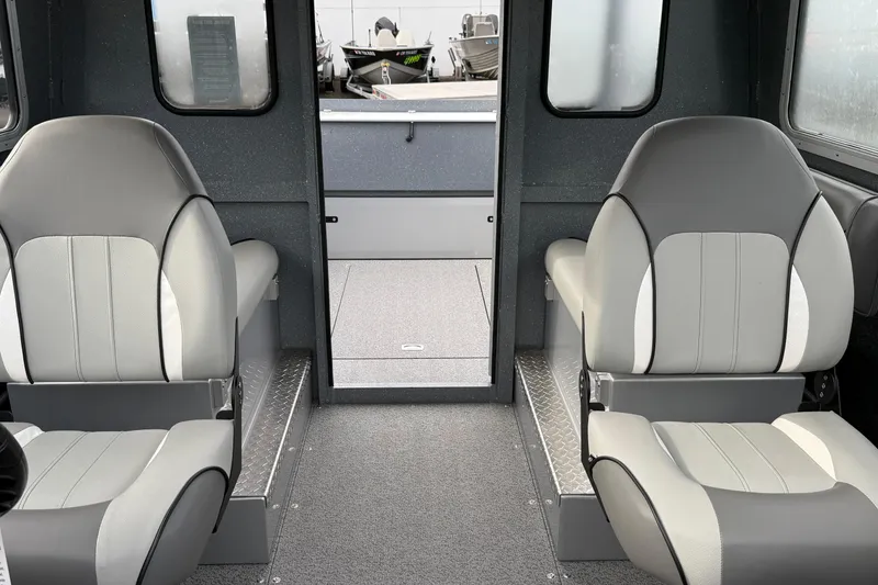Slide: The Image of Interior of 2026 KingFisher 2025 Escape HTT boat with gray seating and windows. - 30