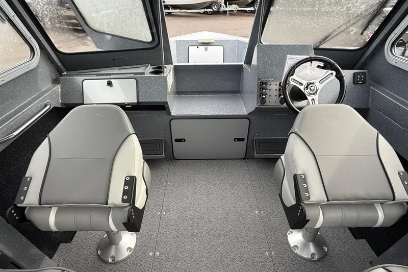 Slide: The Image of Interior of 2026 KingFisher 2025 Escape HTT boat with two seats and steering wheel. - 33