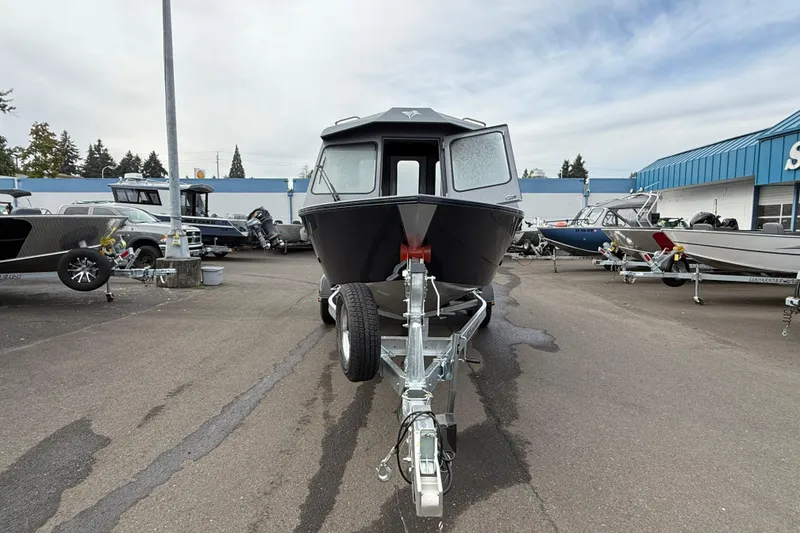 Slide: The Image of 2026 KingFisher 2025 Escape HTT boat on trailer at dealership lot. - 6