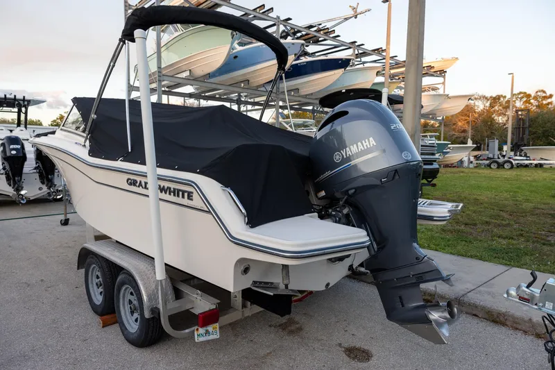 The Image of 2021 Grady-White Freedom 215 boat with Yamaha engine on a trailer. - 0
