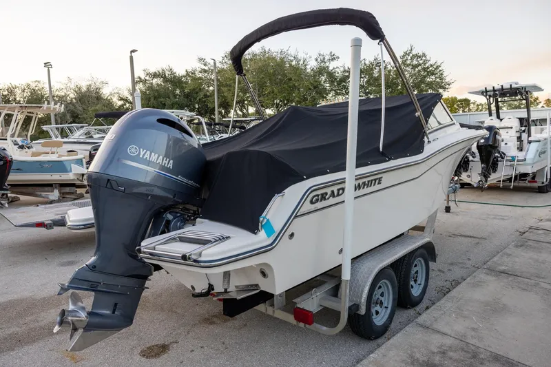 Slide: The Image of 2021 Grady-White Freedom 215 boat on trailer with Yamaha outboard motor. - 3