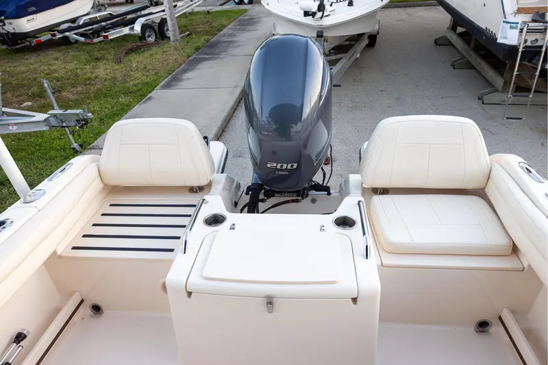Slide: The Image of 2021 Grady-White Freedom 215 boat interior with Yamaha 200 engine, featuring comfortable seating. - 6