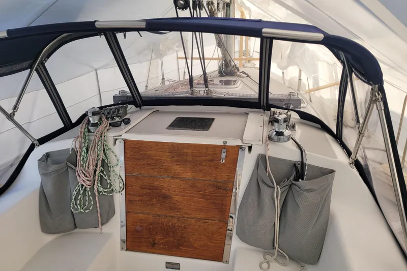 Slide: The Image of Cockpit of a 2006 Catalina 320 sailboat with ropes and winches. - 11