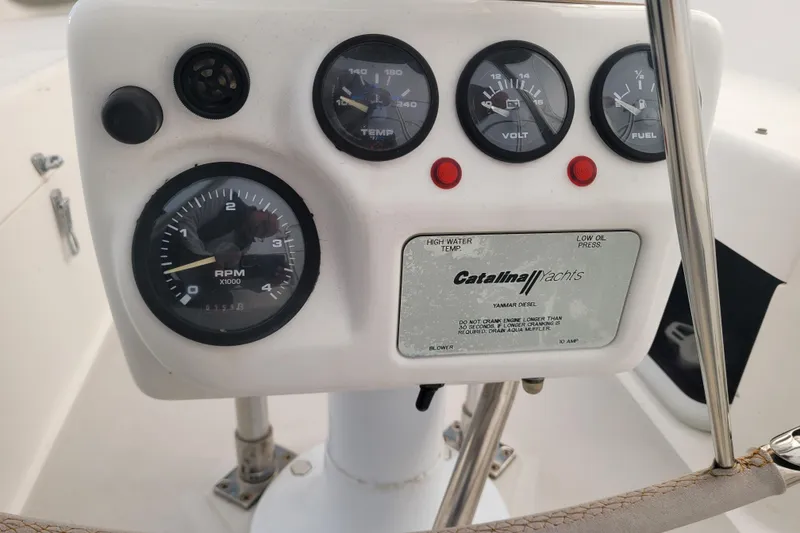 Slide: The Image of Instrument panel of a 2006 Catalina 320 yacht with gauges and indicators. - 16