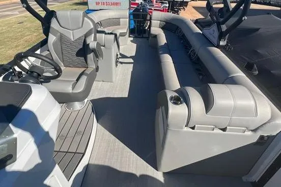 Slide: The Image of Interior of 2023 Montara Naxos boat with gray seating and steering area. - 5