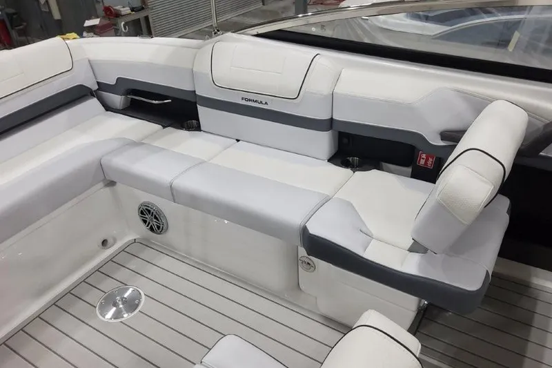 Slide: The Image of 2026 Formula 270 Bowrider interior with sleek white seating and modern design. - 10