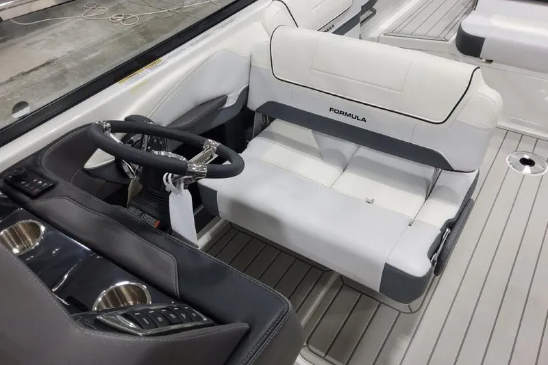 Slide: The Image of 2026 Formula 270 Bowrider interior with sleek steering wheel and comfortable seating. - 12