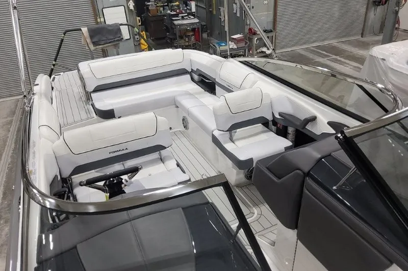 Slide: The Image of 2026 Formula 270 Bowrider interior with sleek white seating and modern design. - 17