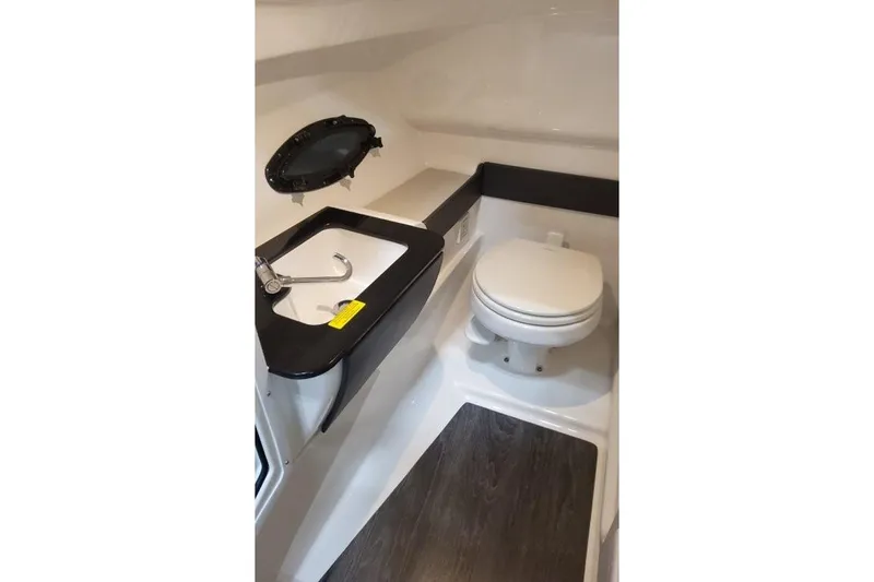 Slide: The Image of Interior of 2026 Formula 270 Bowrider boat bathroom with sink and toilet. - 18