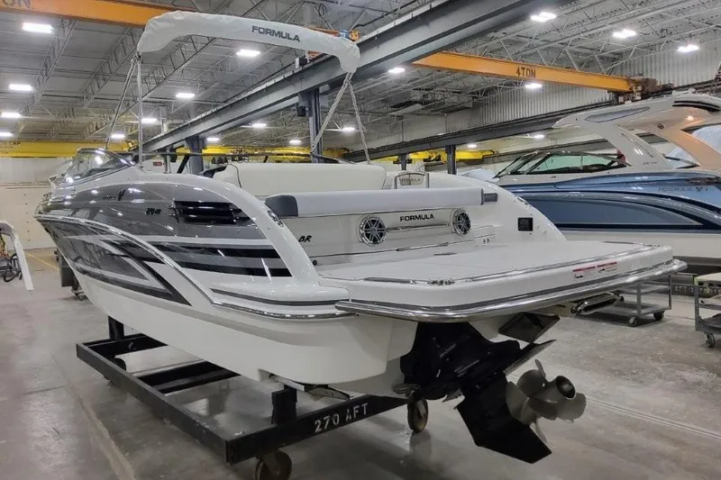 Slide: The Image of 2026 Formula 270 Bowrider boat in a showroom, showcasing sleek design and modern features. - 5