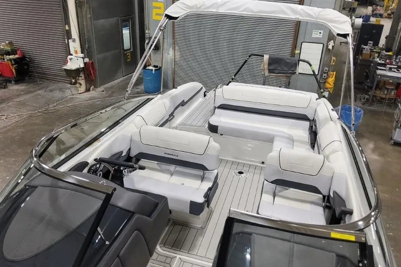 Slide: The Image of 2026 Formula 270 Bowrider boat interior with spacious seating in a workshop setting. - 7