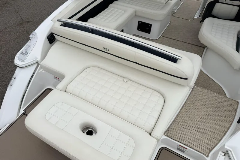 Slide: The Image of 2019 Cobalt R5 Surf boat interior with white cushioned seating and carpeted flooring. - 21