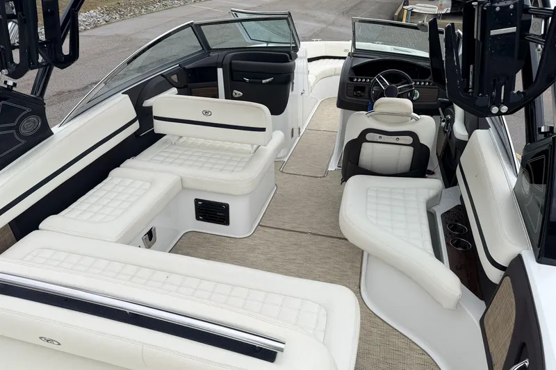 Slide: The Image of 2019 Cobalt R5 Surf boat interior with luxurious white seating and modern dashboard. - 22