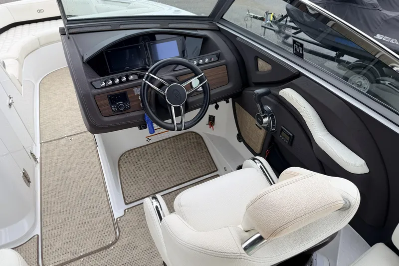 Slide: The Image of 2019 Cobalt R5 Surf boat cockpit with modern steering and control panel. - 24