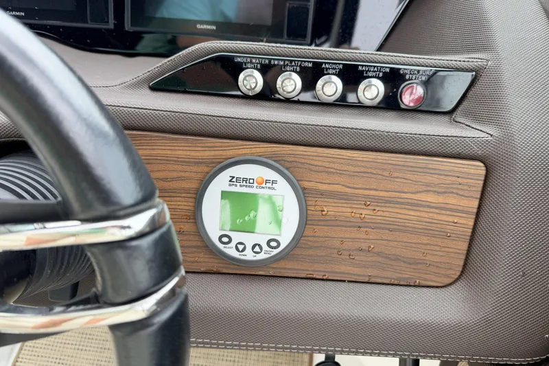 Slide: The Image of Dashboard of a 2019 Cobalt R5 Surf boat with GPS speed control and light switches. - 26