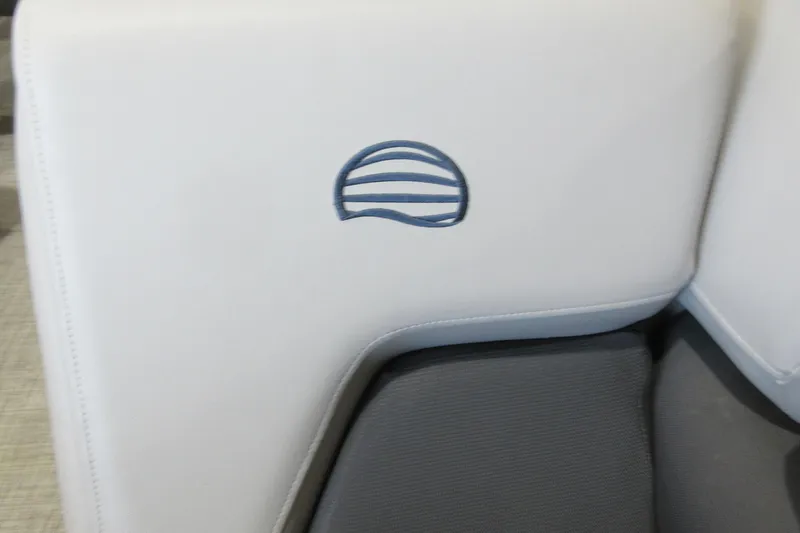 Slide: The Image of 2026 Sun Tracker Party Barge 20 DLX seat with logo detail. - 12