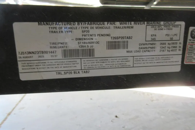Slide: The Image of Label on Sun Tracker Party Barge 20 DLX trailer, detailing specifications and manufacturing information. - 13