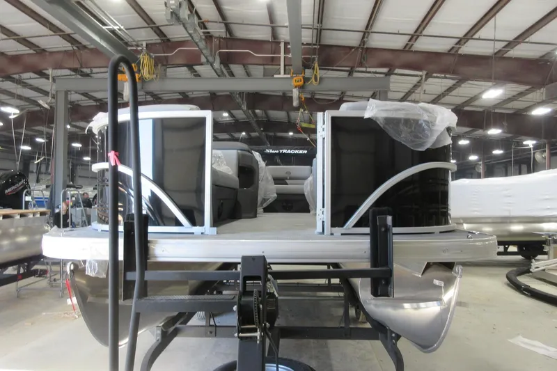 Slide: The Image of 2026 Sun Tracker Party Barge 20 DLX pontoon boat in a manufacturing facility. - 3