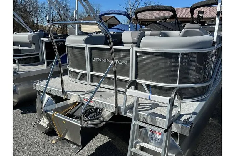 Slide: The Image of 2026 Bennington 20 SSR Quad Bench pontoon boat with Yamaha 90Hp engine, rear view. - 18