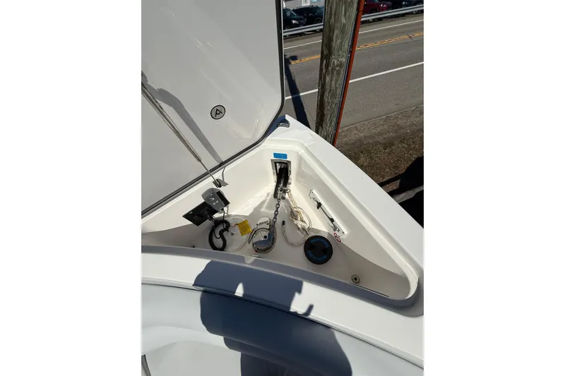 Slide: The Image of 2023 Aviara AV32 I/O boat anchor compartment with chain and rope storage. - 15