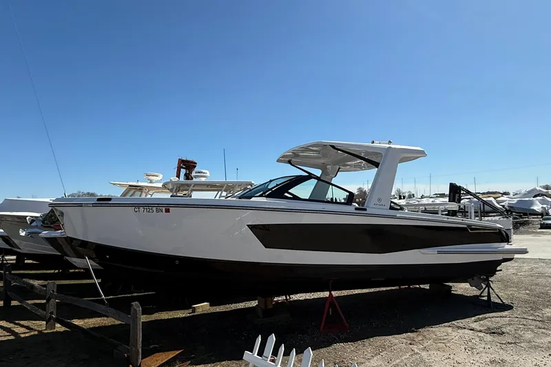 The Image of 2023 Aviara AV32 I/O boat on display under clear blue sky. - 0