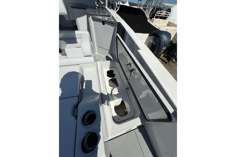 Slide: The Image of 2023 Aviara AV32 I/O boat interior with seating and cup holders. - 10