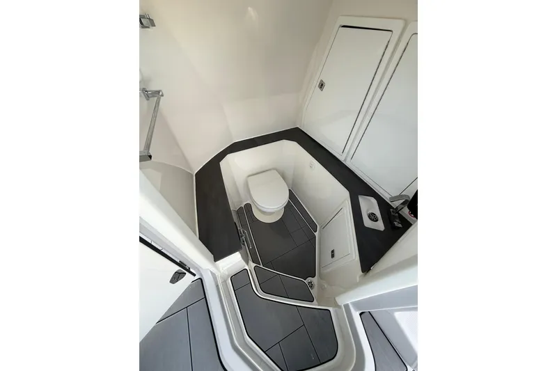 Slide: The Image of 2023 Aviara AV32 I/O boat interior bathroom with modern fixtures and sleek design. - 11