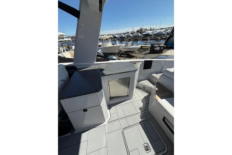 Slide: The Image of 2023 Aviara AV32 I/O boat interior with sleek design and marina view. - 19