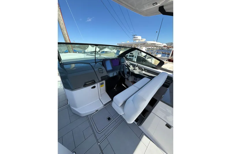 Slide: The Image of 2023 Aviara AV32 I/O boat interior with modern helm and seating. - 20