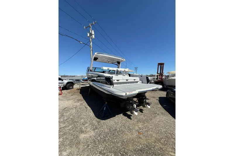 Slide: The Image of 2023 Aviara AV32 I/O boat on display in a sunny outdoor setting. - 3