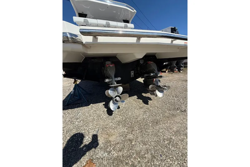 Slide: The Image of 2023 Aviara AV32 I/O boat with dual propellers on display. - 4