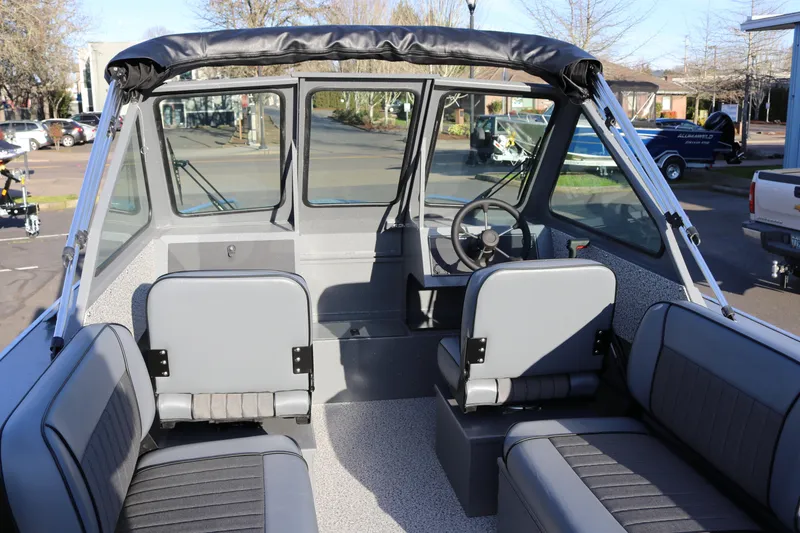 Slide: The Image of 2026 Alumaweld Stryker 220 boat interior with seating and steering wheel. - 10