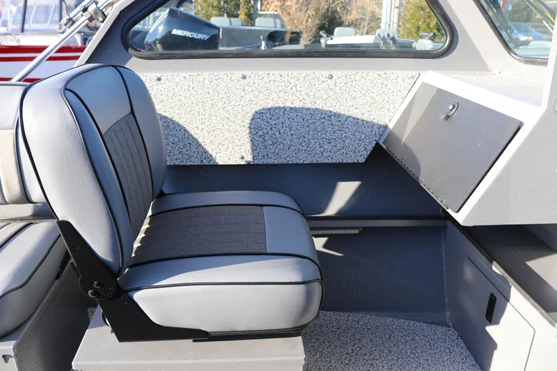 Slide: The Image of Interior of 2026 Alumaweld Stryker 220 boat, featuring a comfortable gray seat. - 15