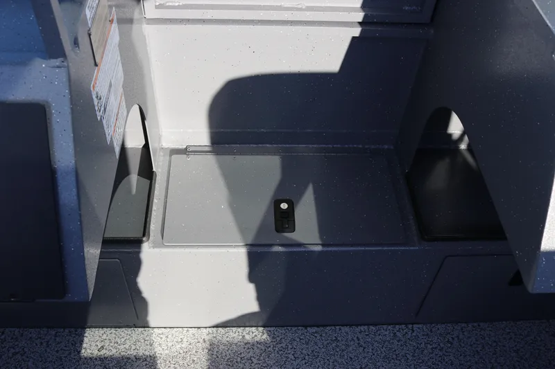 Slide: The Image of Interior view of 2026 Alumaweld Stryker 220 boat with storage compartment. - 17